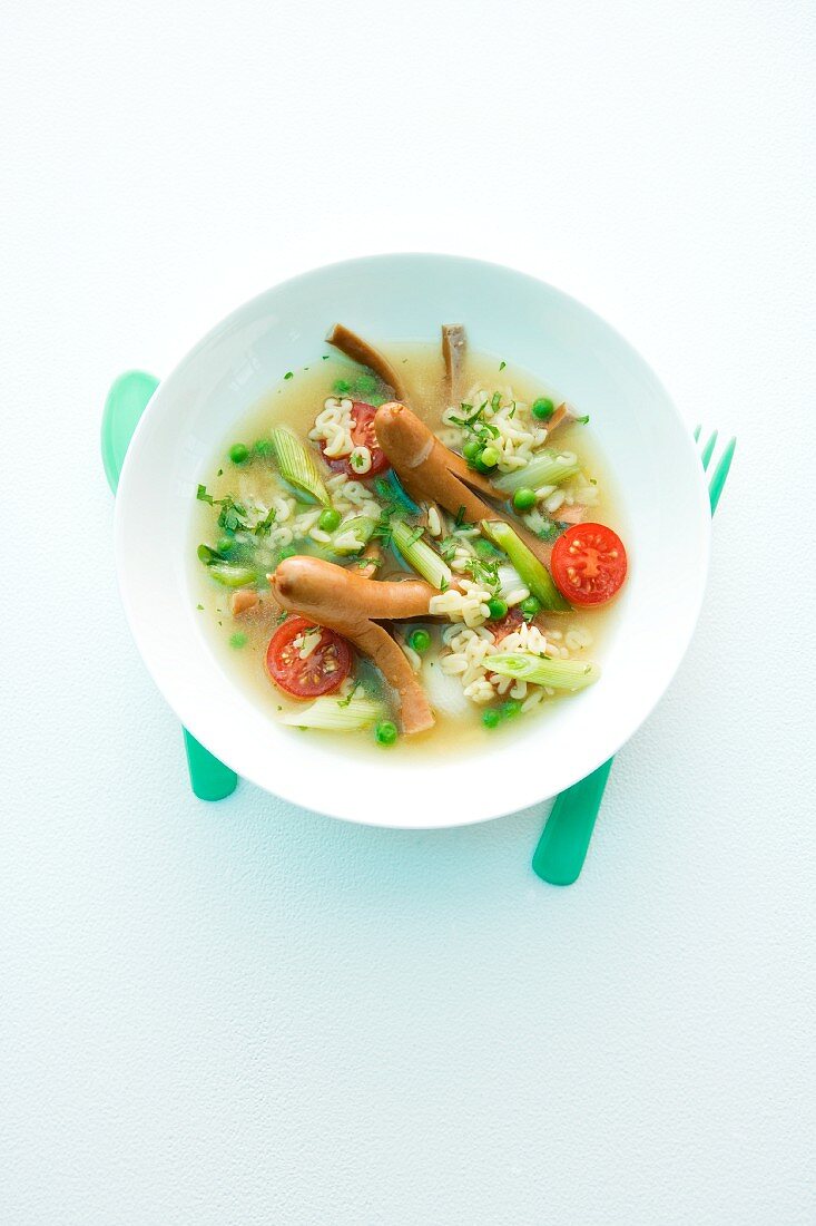 Alphabet soup with vegetables and sausages