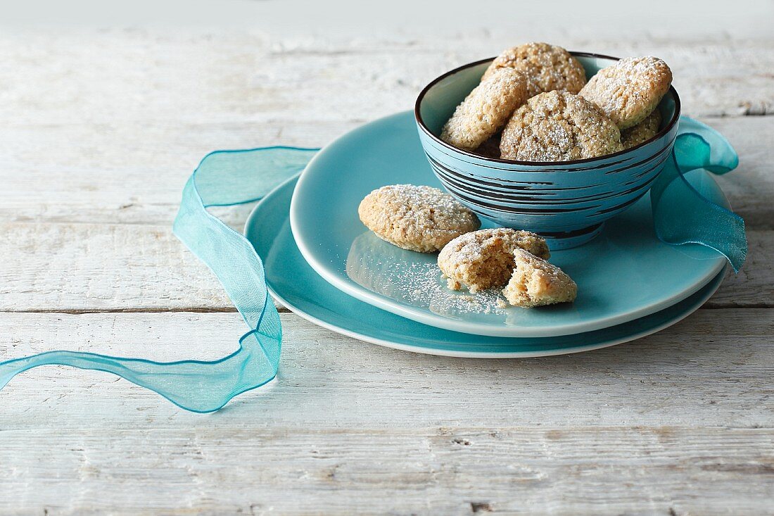 Biscuits in a turquoise bowl with a ribbon