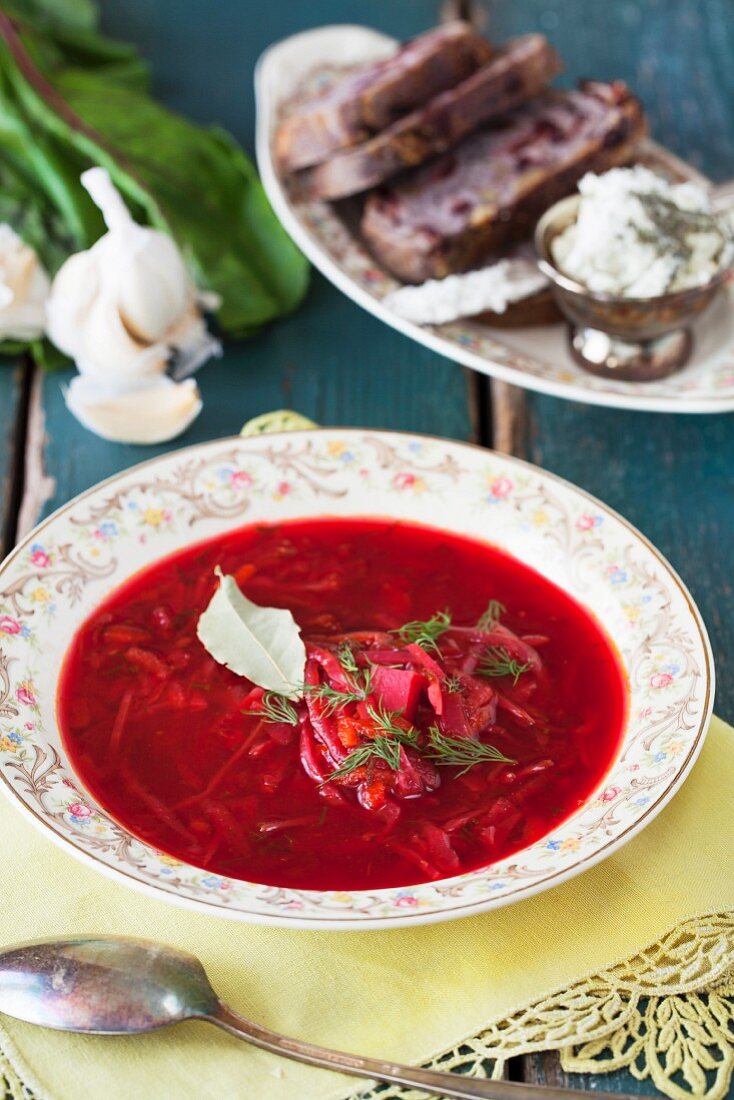 Vegetarian borscht with bread and cheese spread