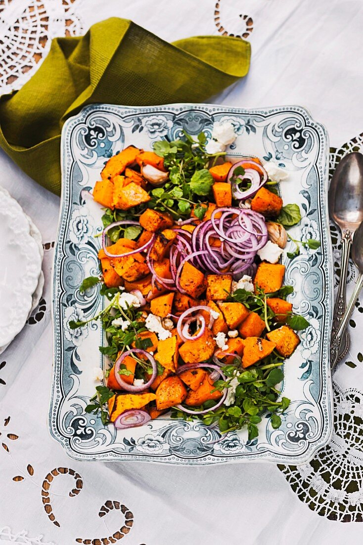 Roasted pumpkin on watercress salad