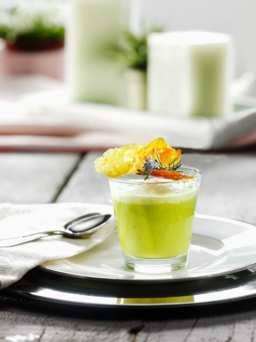 A glass of green asparagus soup