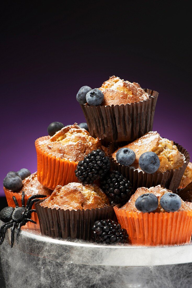 Carrot muffins with blackberries and blueberries for Halloween