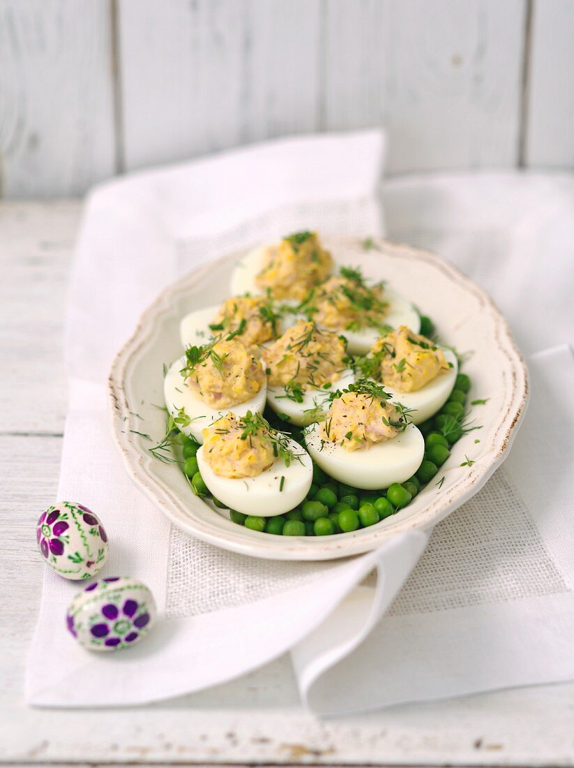 Stuffed eggs on peas for an Easter brunch