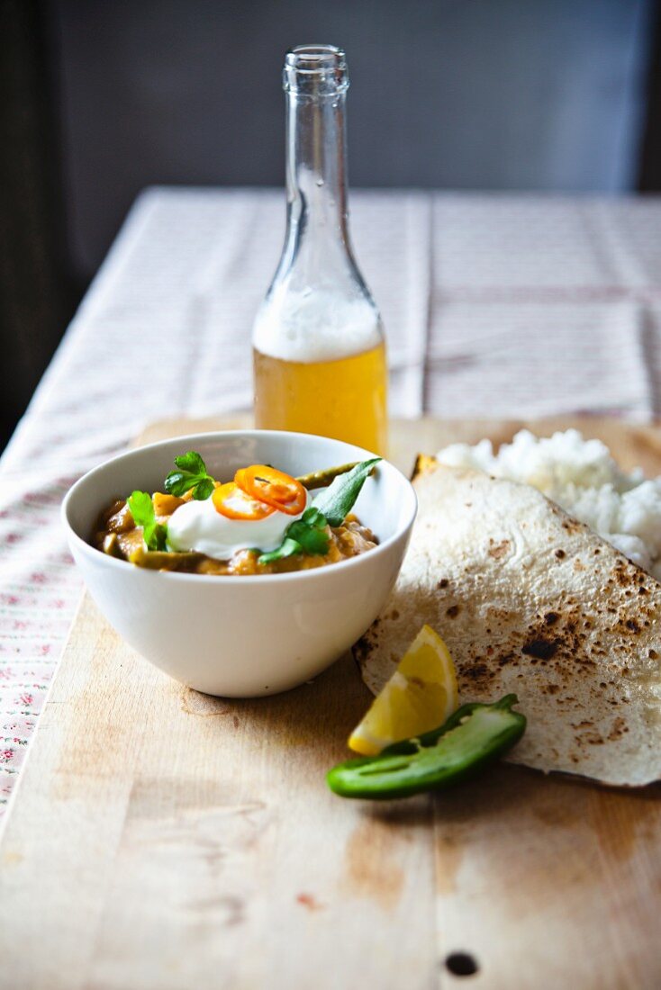 Lentil curry with green beans, basmati rice, chapati and beer