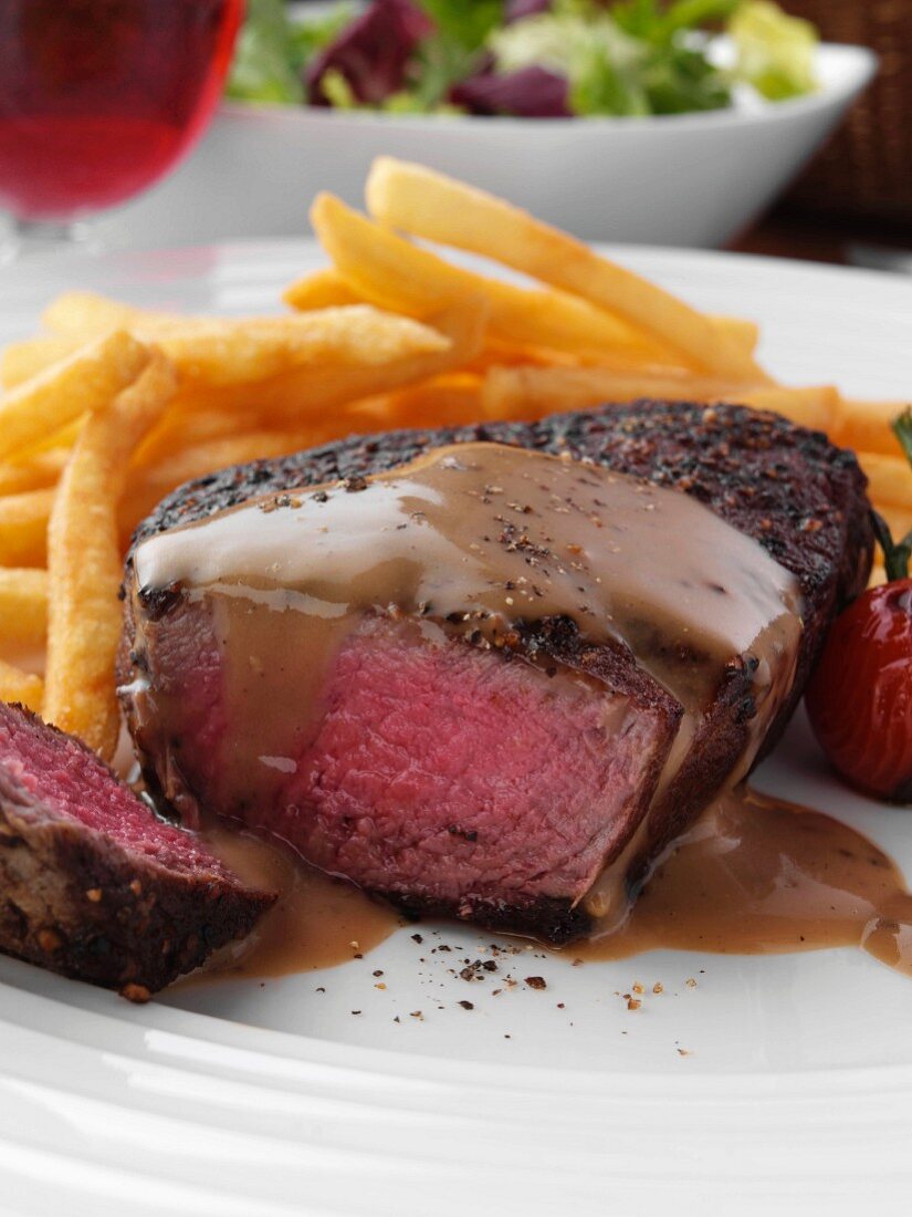 Beef steak with chips, tomatoes and gravy