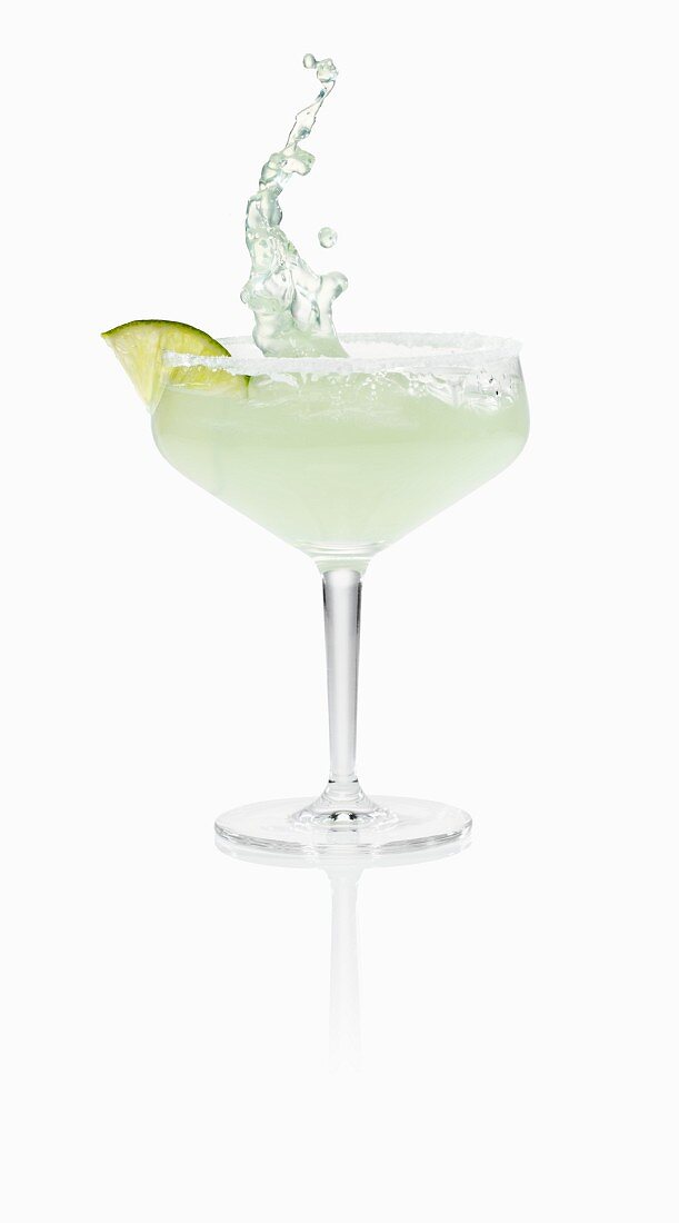 A Margarita splashing out of a glass