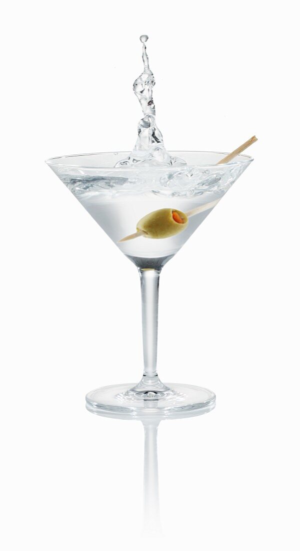 A Vodka Martini splashing out of the glass