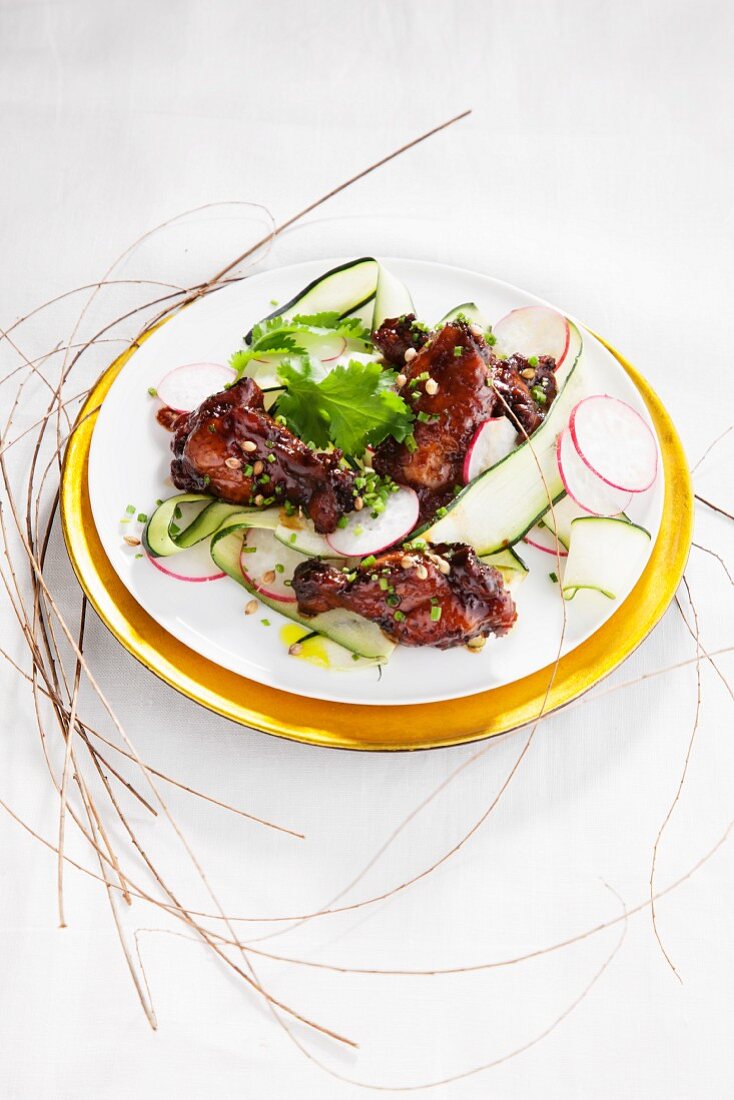 Glazed chicken wings with courgettes, radishes and coriander (Korea)