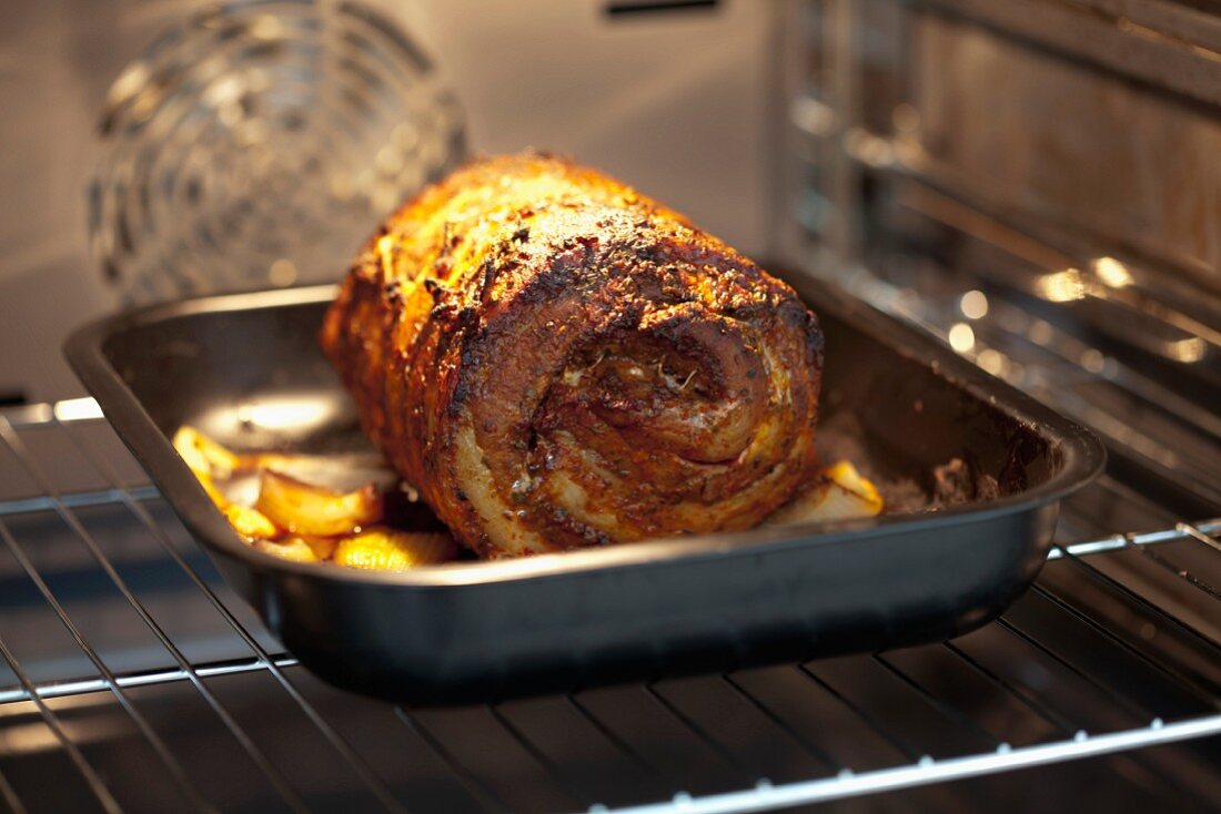 Roast pork roulade in an oven