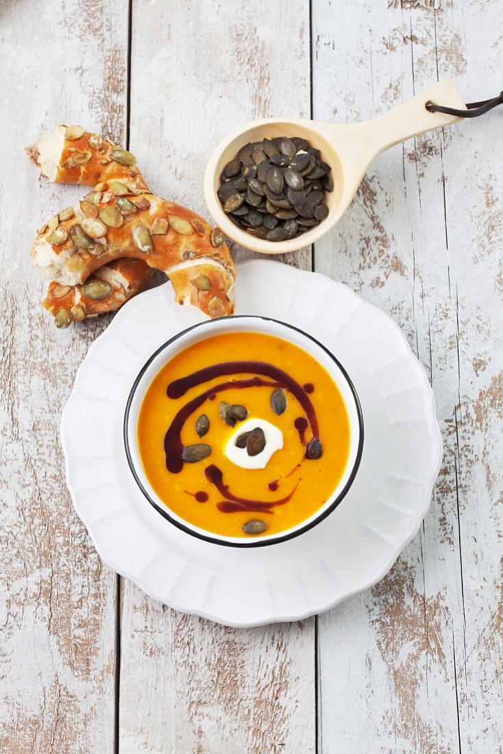 Pumpkin soup with creme fraiche, pumpkin seed oil and pumpkin seeds