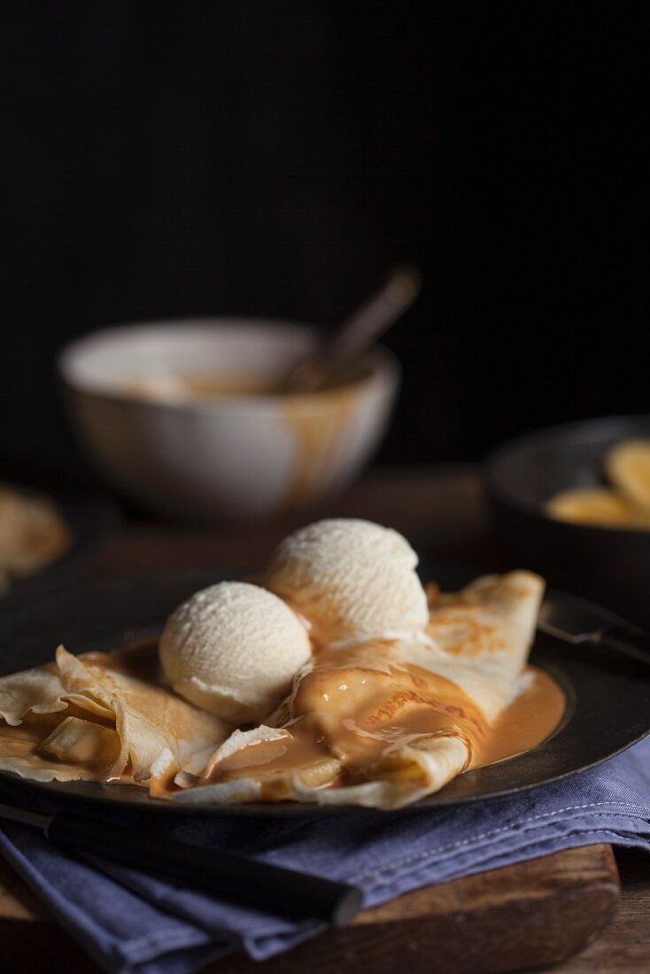 Pancakes with banana, vanilla ice cream and caramel sauce