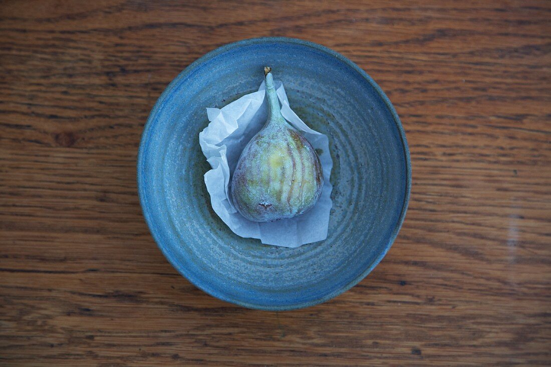 A fresh fig in a dish