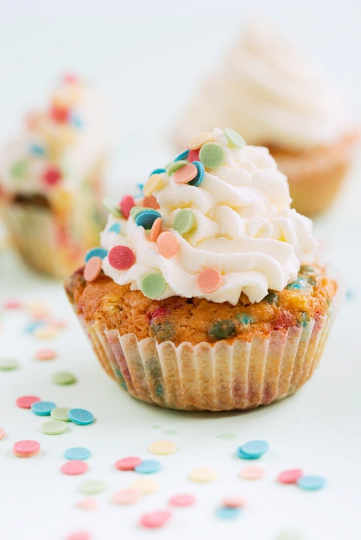 Cupcakes decorated with colourful sugar confetti