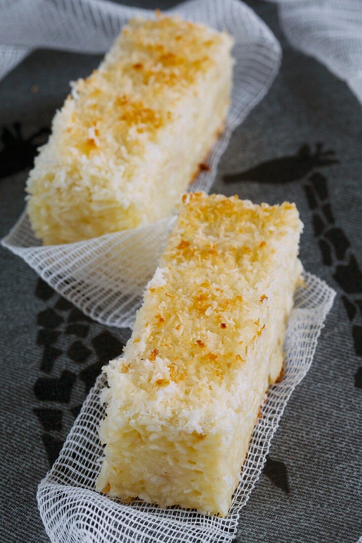 Two slices of coconut and cassava cake