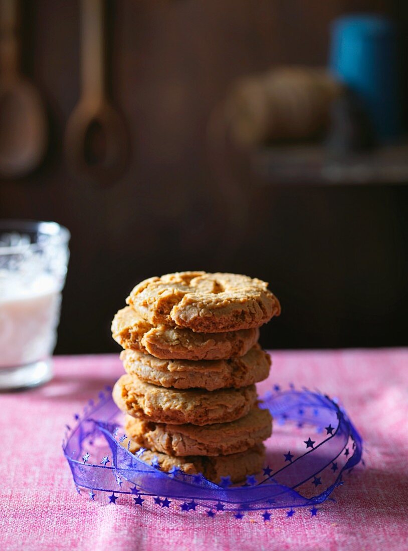 A stack of cookies tied with a purple bow