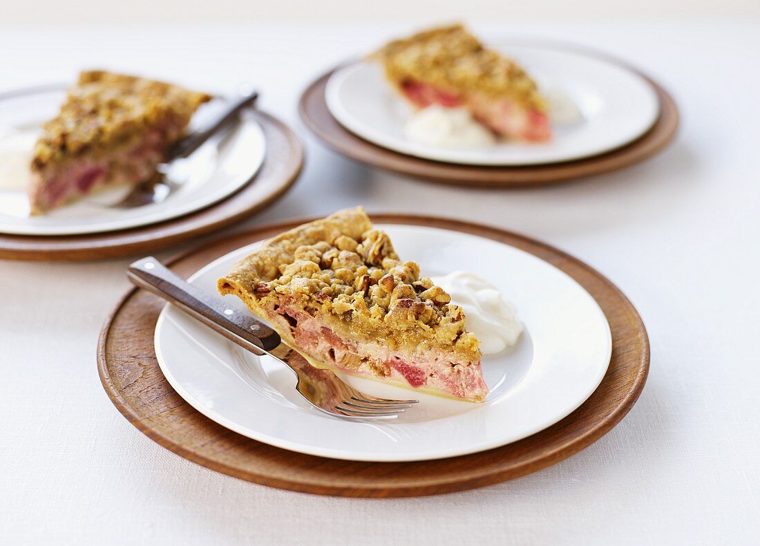 Three slices of rhubarb crumble tart