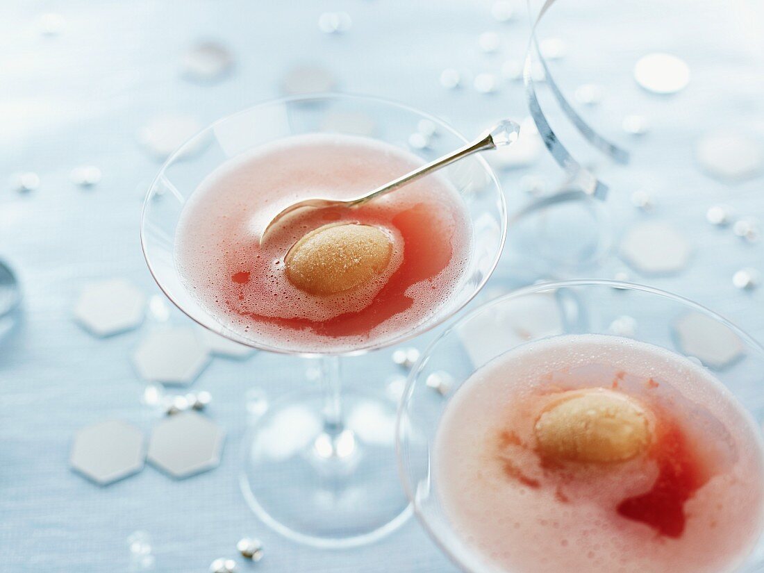Sparkling wine cocktails with raspberries and pear