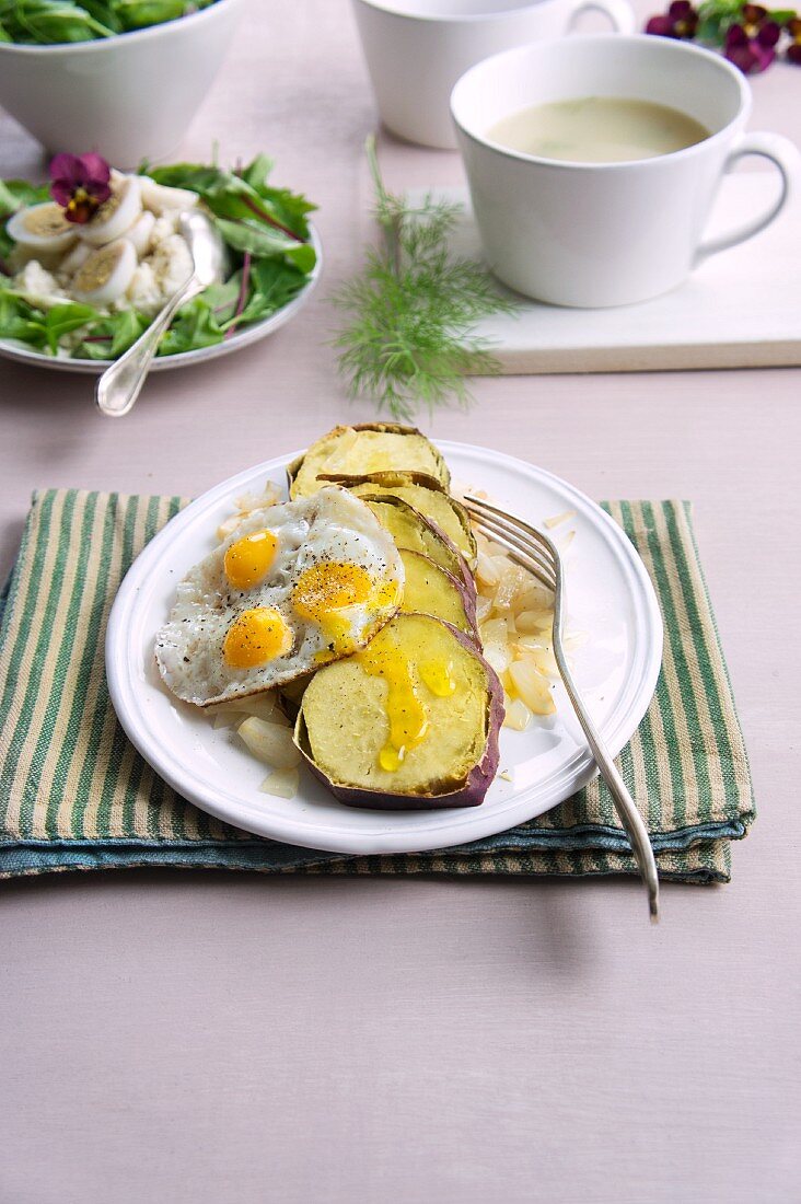 Sweet potatoes with fried quail's eggs