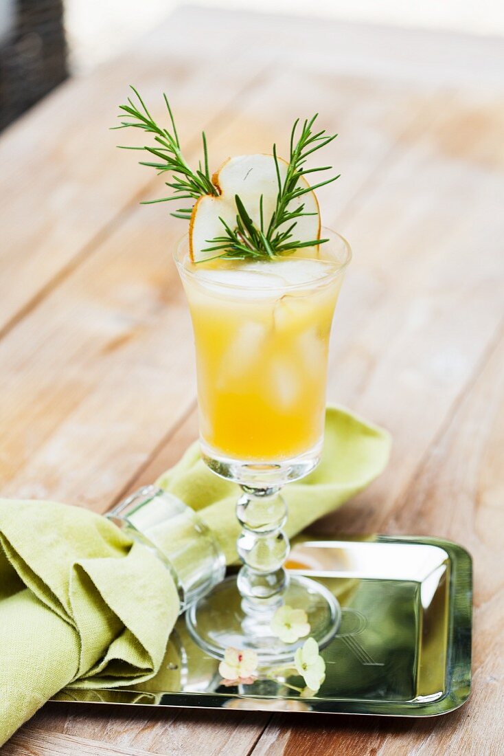A fruity cocktail with rosemary