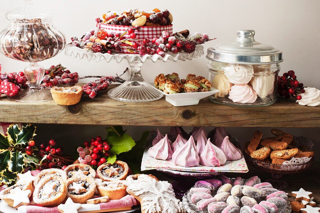 A Christmas buffet featuring meringues, stuffed dates, mince pies, Christmas cake and biscuits