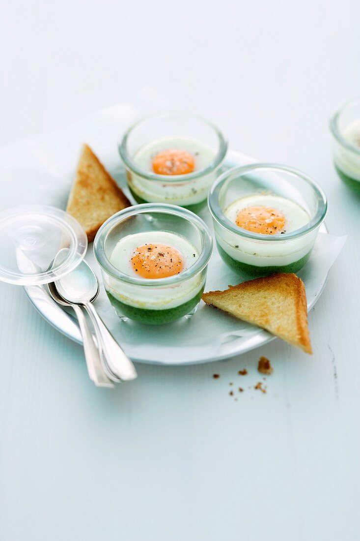 Creamy spinach with egg cooked in jars