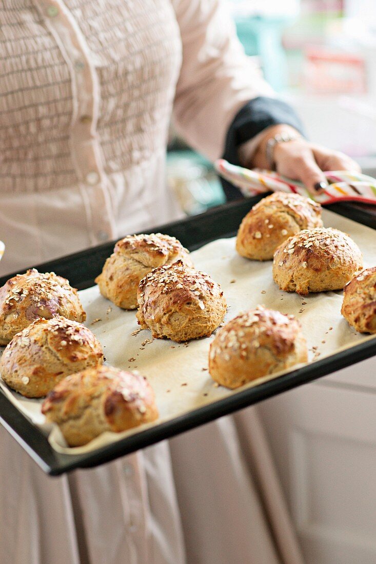 Freshly baked breakfast rolls on a baking tray