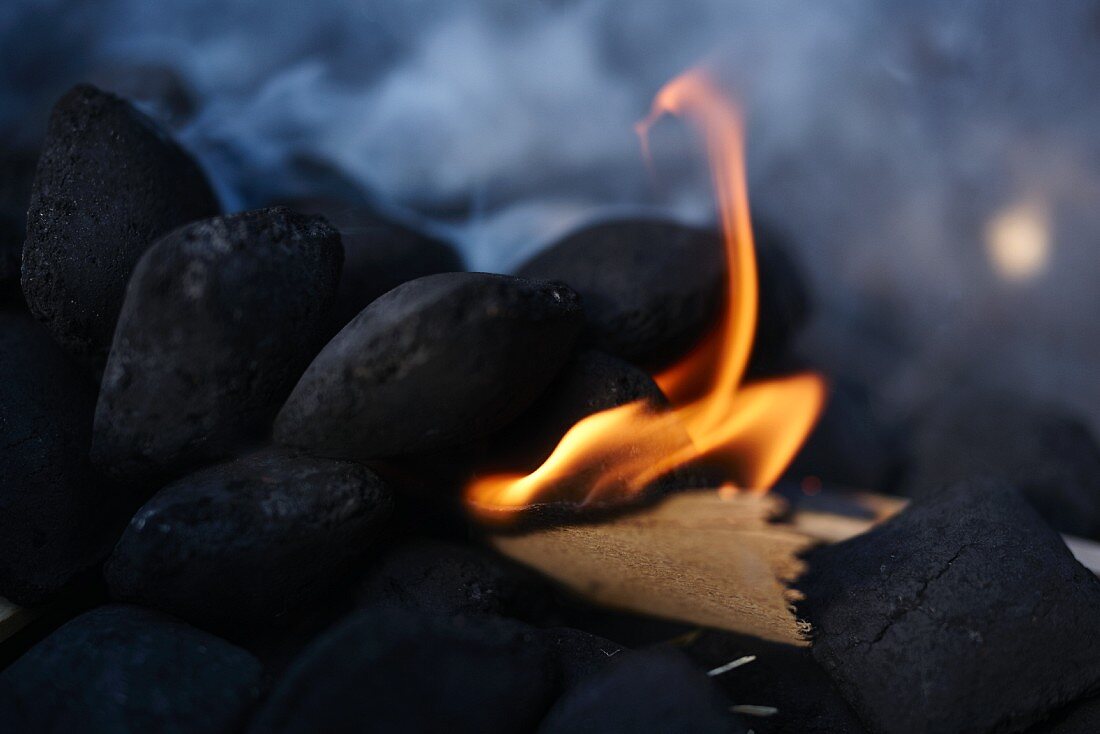 Barbecue coal being lit