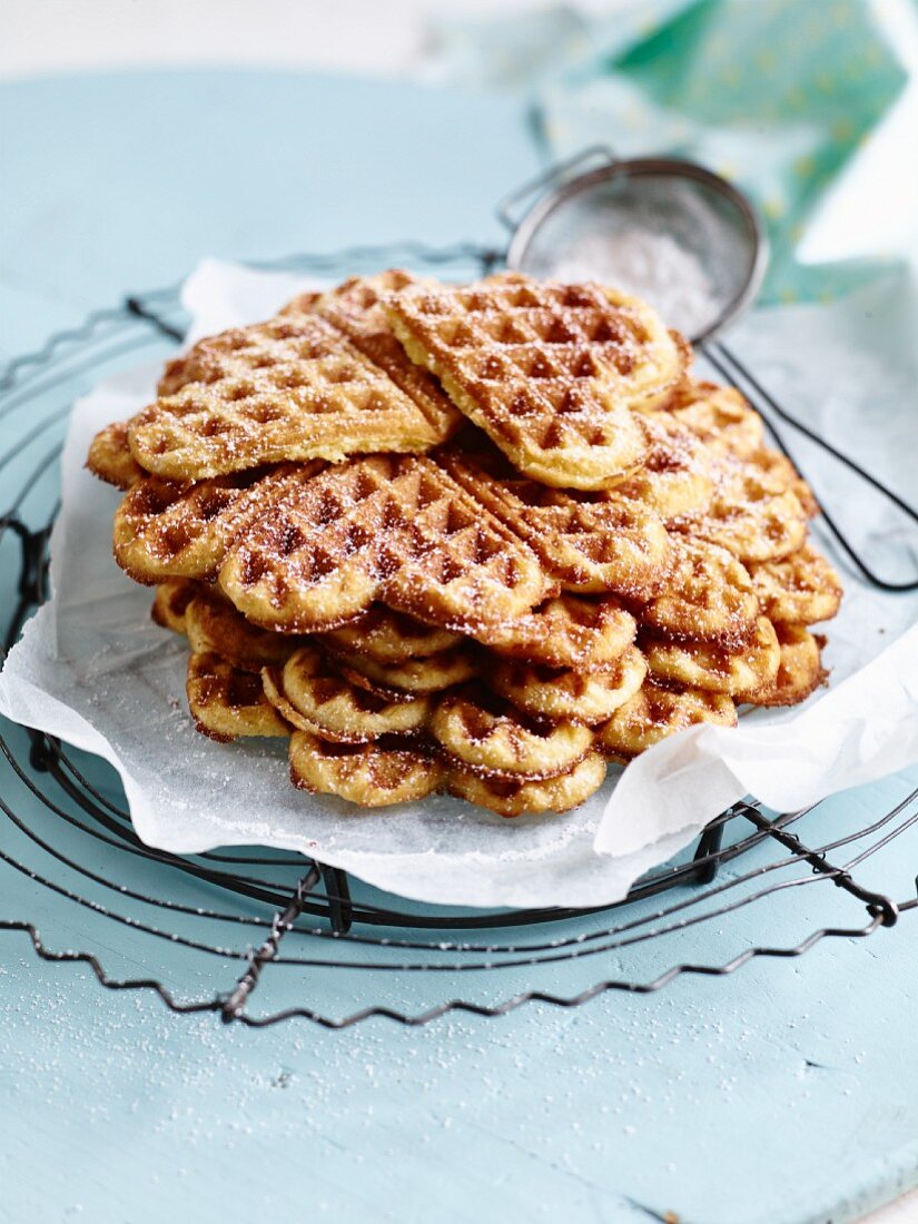 Heart-shaped waffles with icing sugar