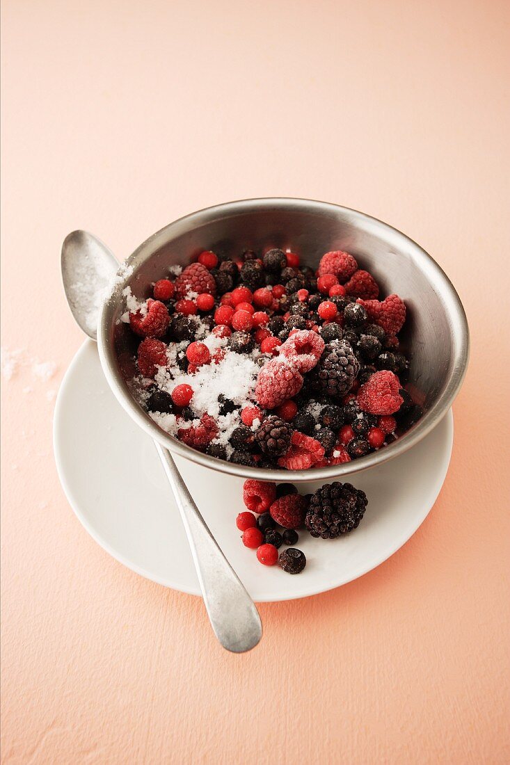 Sugared berries in a metal bowl