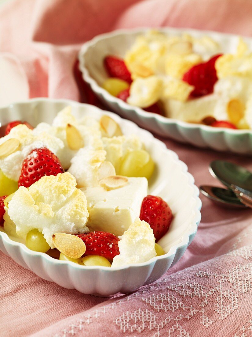 Gratinated sheep's cheese with strawberries, grapes and slivered almonds