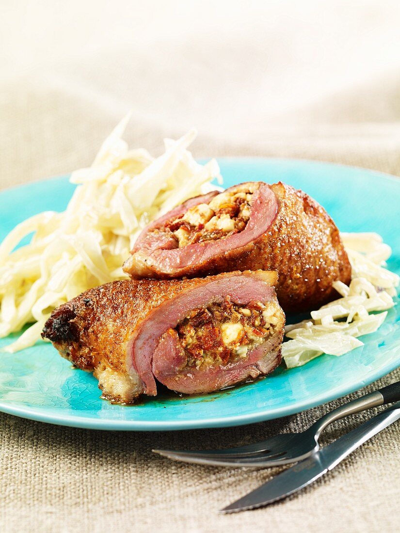 Stuffed duck roulade with white cabbage