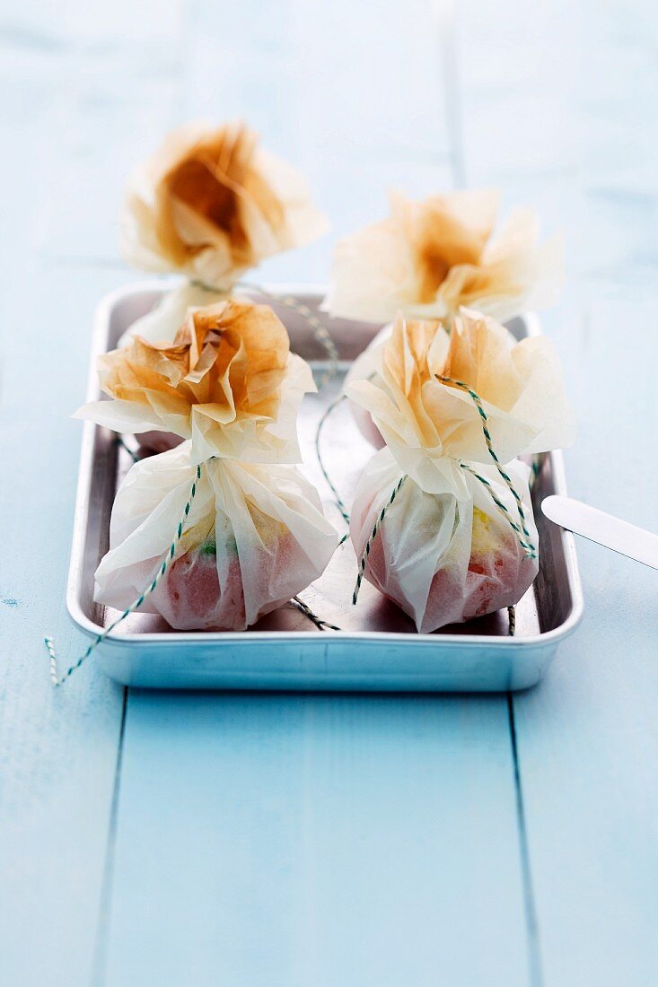 Stuffed tomatoes in paper sacks