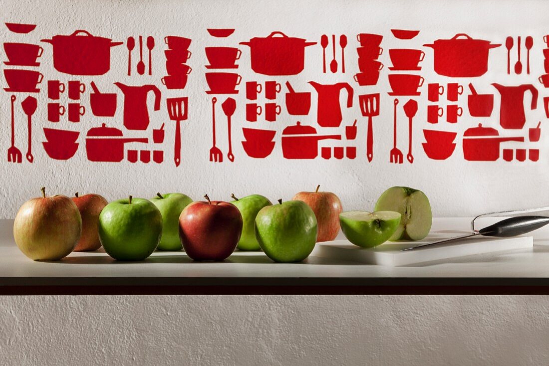 Various apples on a kitchen counter