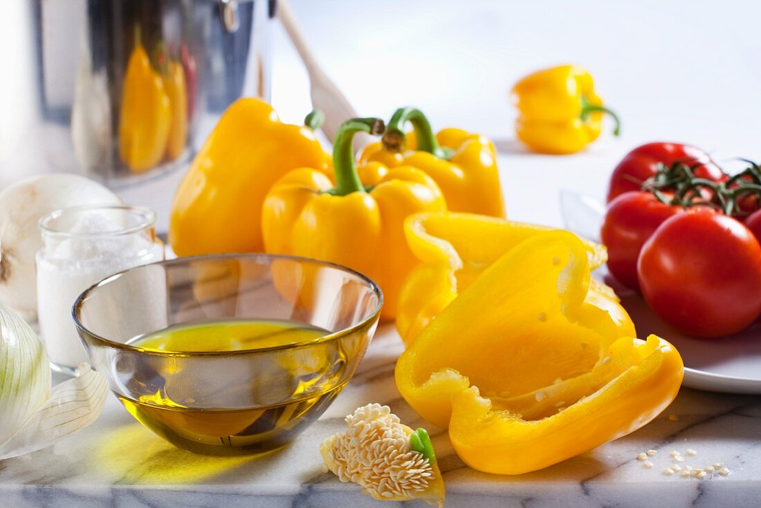 Ingredients for ratatouille: olive oil, peppers, tomatoes, onions and salt