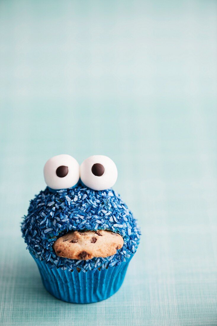 A blue monster cupcake