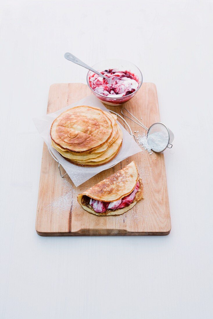 Pancakes filled with red berry jelly and quark