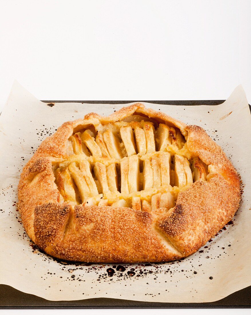 An apple pie on baking paper