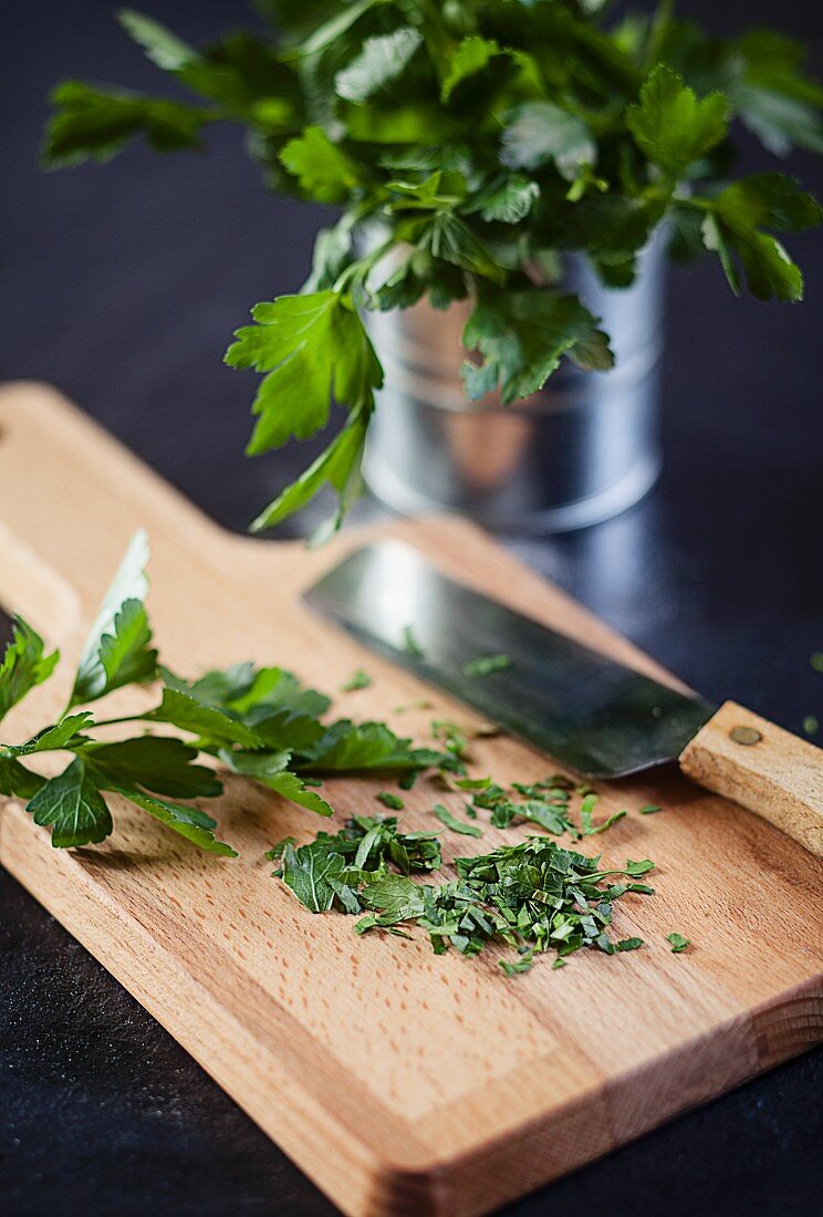 Chopped parsley on a wooden board