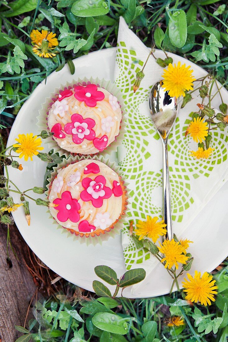Cupcakes with spring flowers in a garden