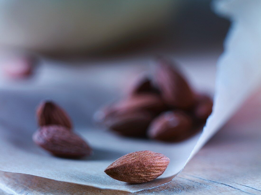 Almonds on a piece of greaseproof paper