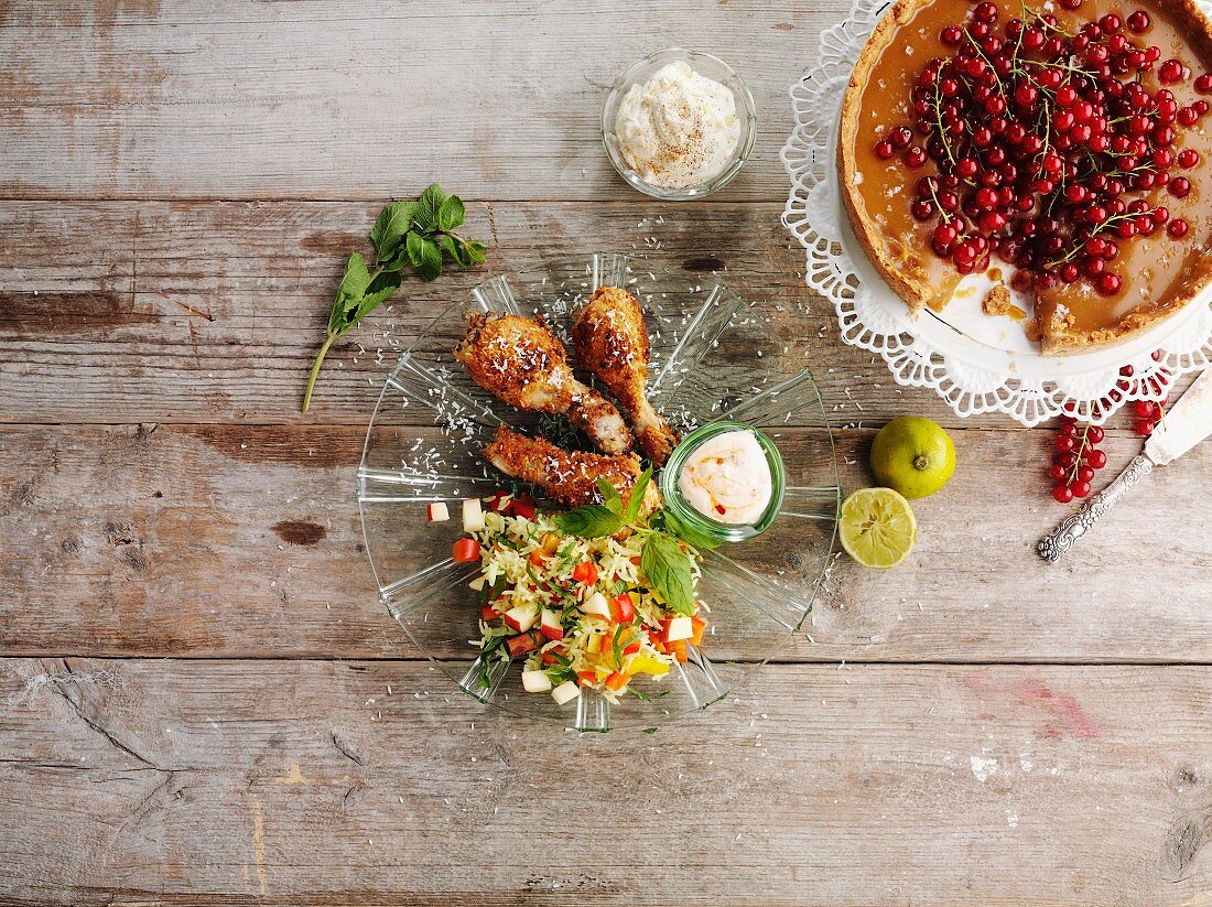 Chicken drumsticks with a side salad and a redcurrant cake