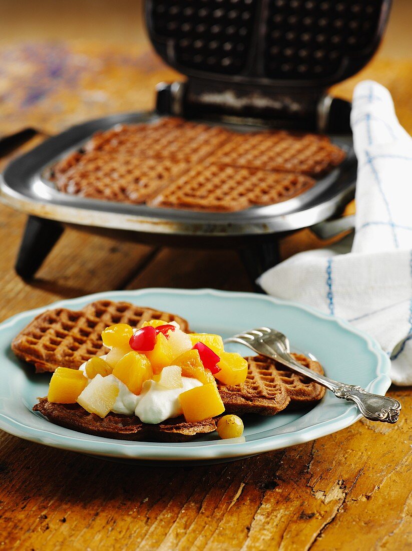 Waffles with fruit compote and cream