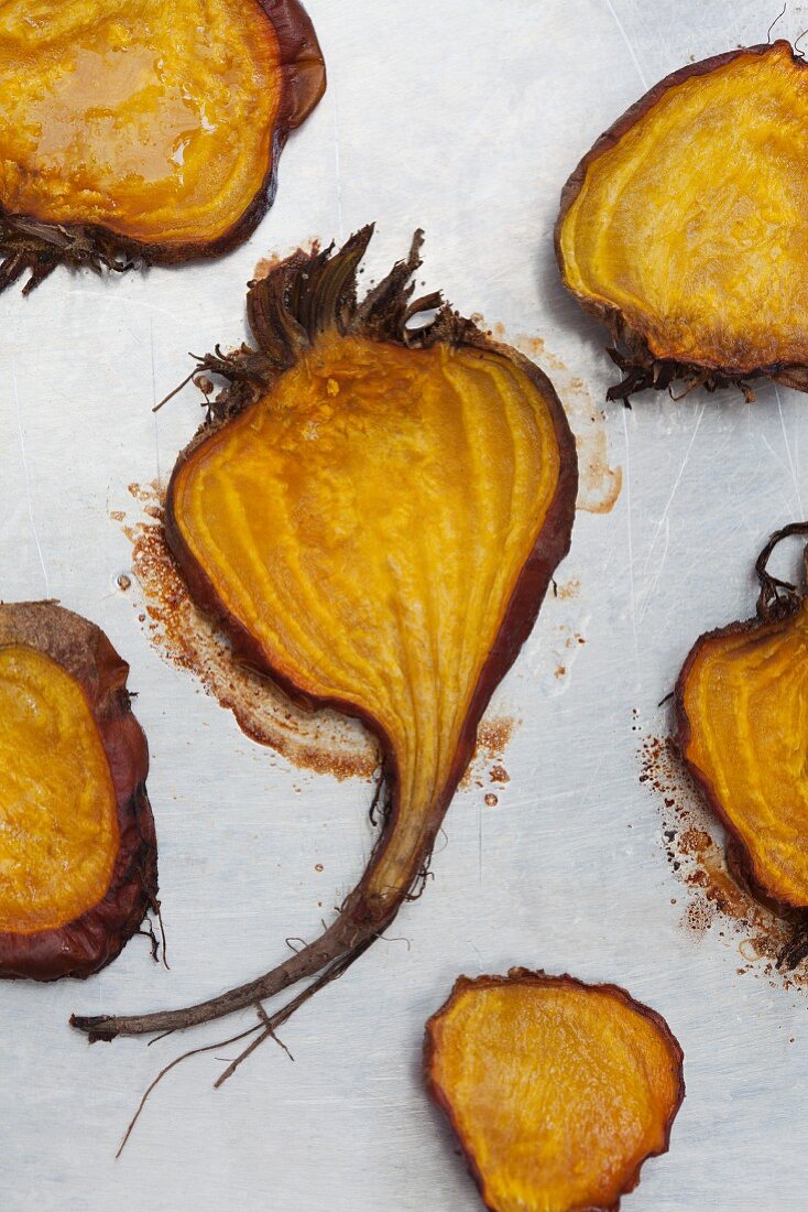 Halved and roasted golden beets with salt and pepper