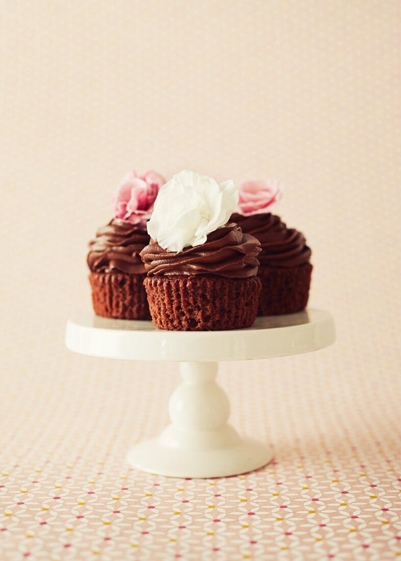 Chocolate and cherry cupcakes on a cake stand