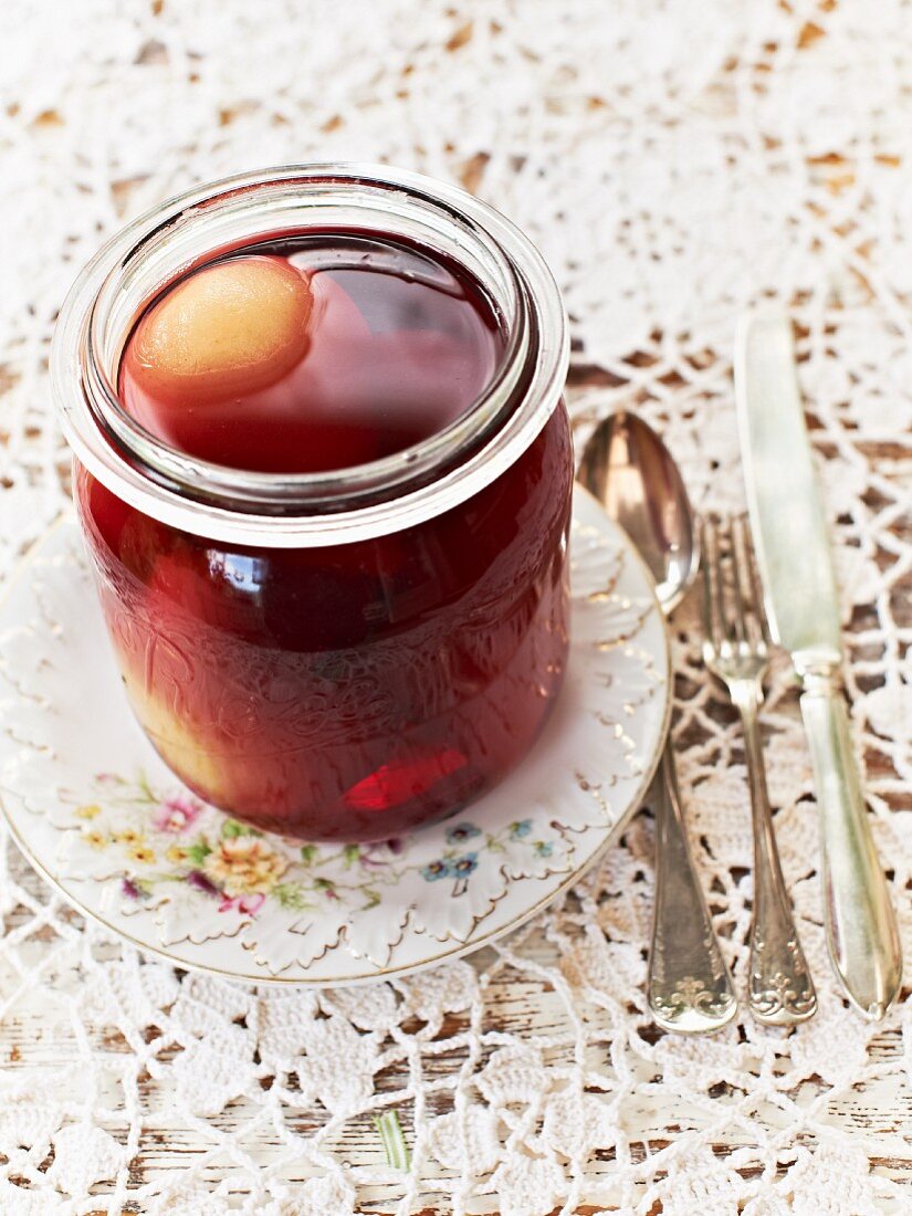 A jar of red wine pears