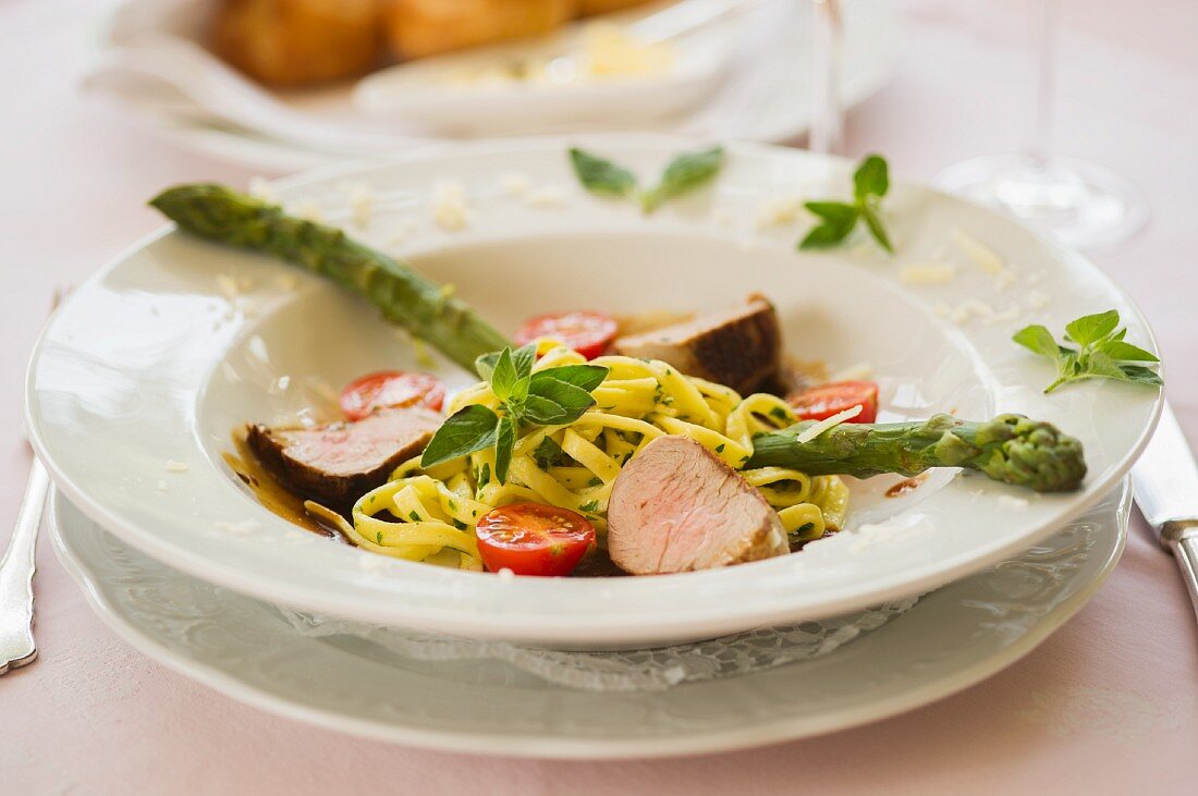Pork medallions with noodles and asparagus