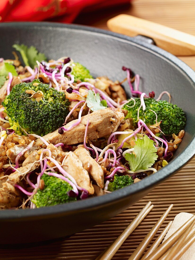 Pork with broccoli and bean sprouts in a wok