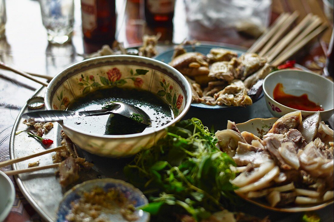 Cooked pork with a herb marinade at a market in Haiphong, Vietnam