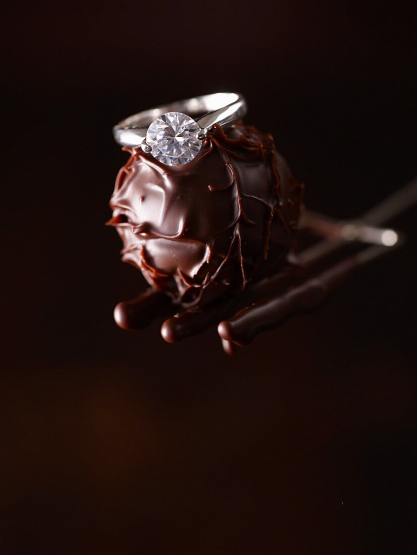 A diamond ring on a chocolate truffle