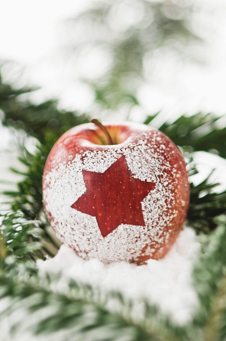 An apple decorated with a star